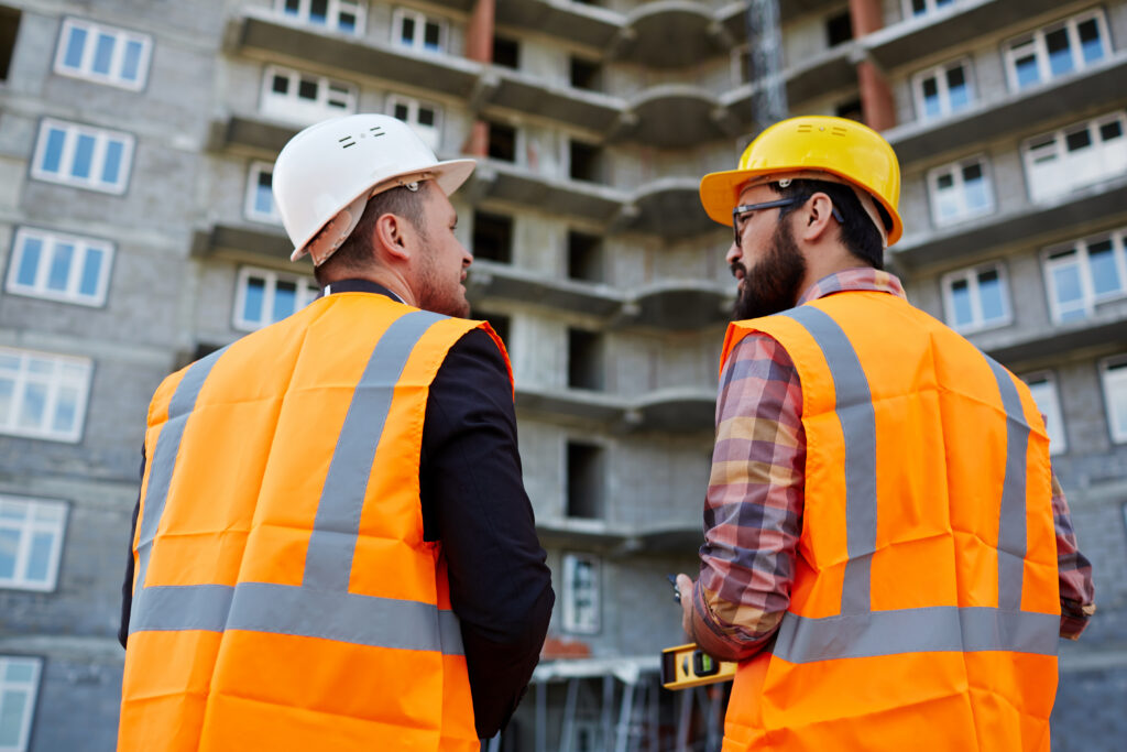 Freepik Construction site worker and manager talking
